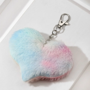 Colorful gradient plush heart keychain with silver metal clasp on minimalist background