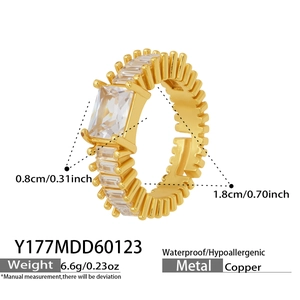 Detailed view of gold copper ring with square cubic zirconia stones and 0.8cm width