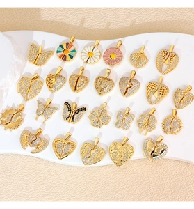 Detailed view of assorted micro-pave zircon heart and wing charms on a white stand