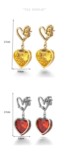 Detail view of heart-shaped crystal earrings with 2.1cm height and 0.8cm width specs