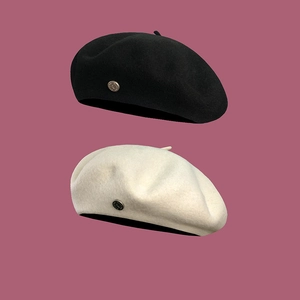 Classic wool beret for women in black and cream white with elegant metal decorative buckle