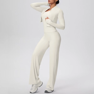 Detailed view of cream yoga set with zip-up jacket, vest top, and high-waist flared pants