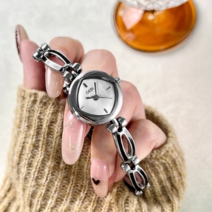 Silver tonneau quartz watch with mother of pearl dial and hollow chain strap for women