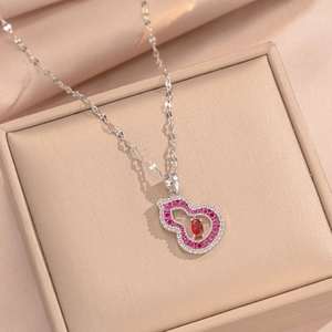 Hollow gourd necklace in 18K gold plating with red oval gemstone and pink diamonds
