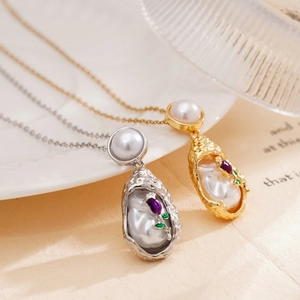 Baroque style pearl necklace with heart pendant on vintage beige book background