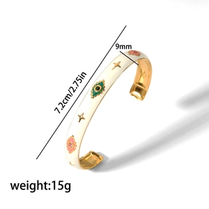 Detailed view of 18K gold stainless steel evil eye cuff bracelet with dimension markings