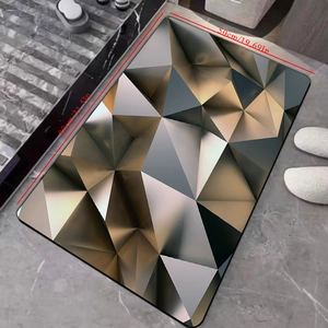 Detail view of 3D geometric absorbent bath mat showing 50x80cm dimensions and pattern