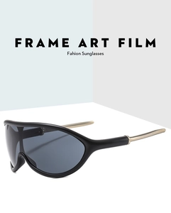 Detail of outdoor cycling sunglasses featuring sleek gold metal temples and black frame