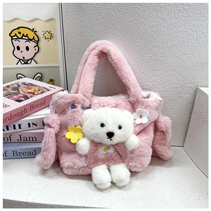 Detail of pink plush kids handbag featuring a 3D white teddy bear and floral accents