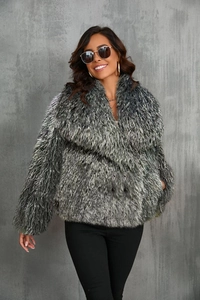 Detail of fluffy grey faux fox fur coat texture with voluminous long-hair layers