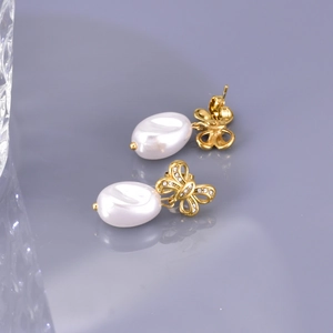 Elegant 18K gold bow earrings with shimmering zircon and teardrop white pearls