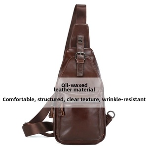 Detail view of oil wax leather texture and stitching on dark brown men's sling bag