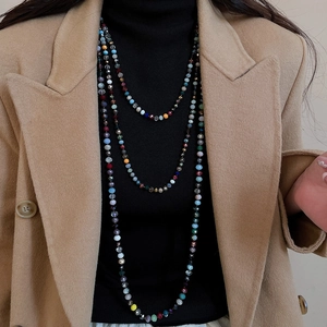 Detail view of multi-layer colorful crystal beaded necklace with multi-faceted cutting beads