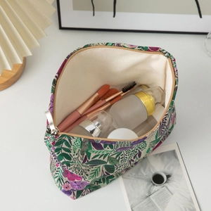 Detail of floral embroidery canvas makeup bag with spacious interior for toiletries