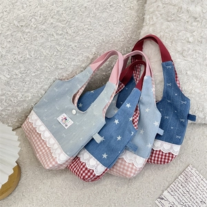 Close-up of sweet lace-trimmed canvas handbags with star prints and contrast stitching
