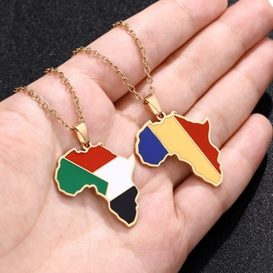 Detail of African map pendant necklaces with Sudan and Chad flag enamel on gold chains