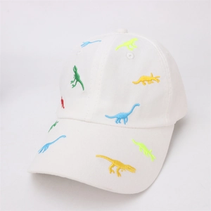 Close-up of colorful dinosaur embroidery on a premium white cotton baseball cap for kids