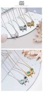 Detail of shell butterfly pendant necklaces in silver, gold and rose gold with micro-pave