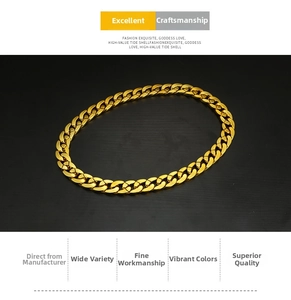 Close-up of a chunky gold-tone hip hop curb link chain with a high-polished finish