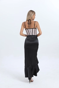 Back view of corset bodice dress with black satin ruffles and thin shoulder straps