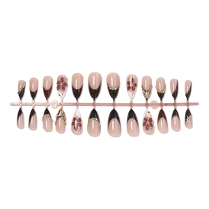 Almond press-on nails with 3D floral accents and sparkling rhinestone french tips