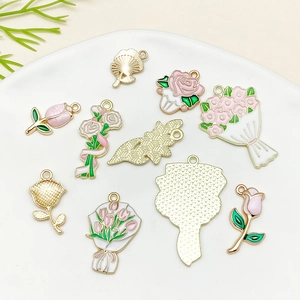 Pink enamel flower charms in rose and tulip designs for DIY jewelry making