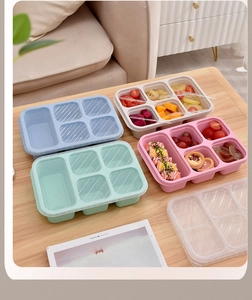Top view of eco-friendly wheat straw bento boxes with five compartments and lids