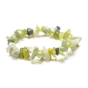 Detailed macro shot of irregular natural green and white crystal stone beads bracelet