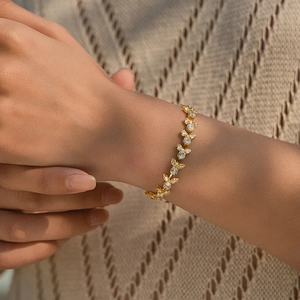 Close-up of 18K gold plated bracelet with sparkling marquise and round cubic zirconia