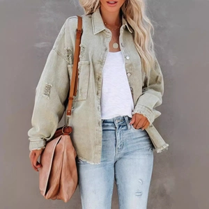 Relaxed fit light green distressed denim jacket with frayed hems and ripped details