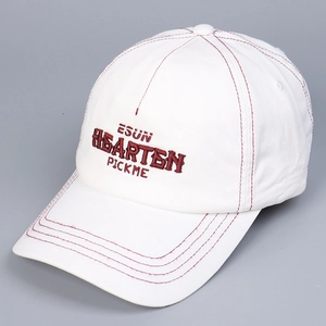 Detail of white cotton baseball cap with burgundy stitching and 3D letter embroidery
