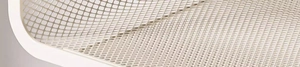 Close-up of the white metal mesh texture and durable frame of the kitchen storage rack