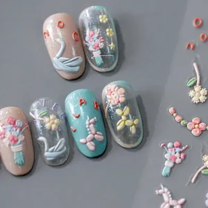 Detailed 3D embossed nail stickers featuring colorful swan, floral and balloon patterns