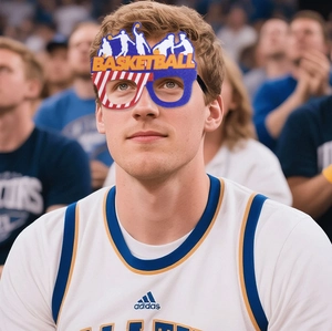 Detail of Basketball party glasses with logo letters worn by a fan at a stadium