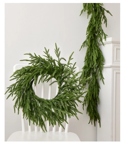 Detail of lifelike Norfolk Pine wreath and garland set with realistic green needles