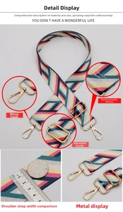 Macro detail of 3.8cm striped woven bag strap with adjustable golden metal hardware buckle