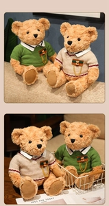 Detailed close-up of teddy bears wearing knitted sweaters and embroidered Teddy logo