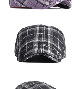 Detailed view of the classic plaid wool blend texture on the purple and grey flat cap