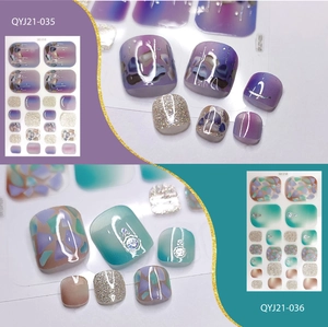 Detail of purple and green toenail stickers with glitter and rhinestone patterns