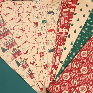 Multiple patterns of Christmas kraft wrapping paper with reindeer and snowflakes on green background