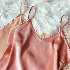 Elegant satin V-neck camisole set with silky pearlescent finish and thin shoulder straps