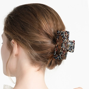 Brown leopard print claw clip for women featuring square hollow design and glitters