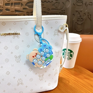Adorable blue bear mini Whac-A-Mole game console keychain pendant on a white bag