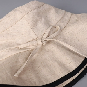 Women's cotton linen sun hat in beige with black contrast trim and bow detail