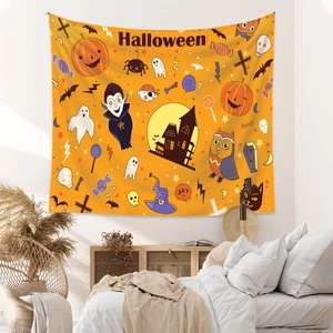 Detail of vibrant orange Halloween tapestry featuring cartoon ghosts and pumpkins on a wall
