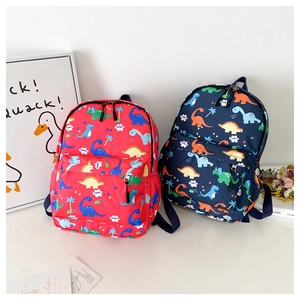 Detail view of red and navy blue toddler backpacks with colorful dinosaur prints and zippers