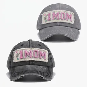 Vintage washed baseball caps with #1 MOM embroidered patches and distressed brim details