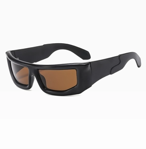 Close-up of chunky square cyberpunk sunglasses with black thick frames and brown lenses