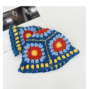 Detailed top view of handmade crochet bucket hat with colorful retro floral patterns