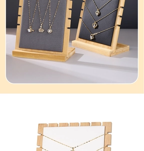 Detail of solid wood necklace stand with velvet surface and multiple display notches